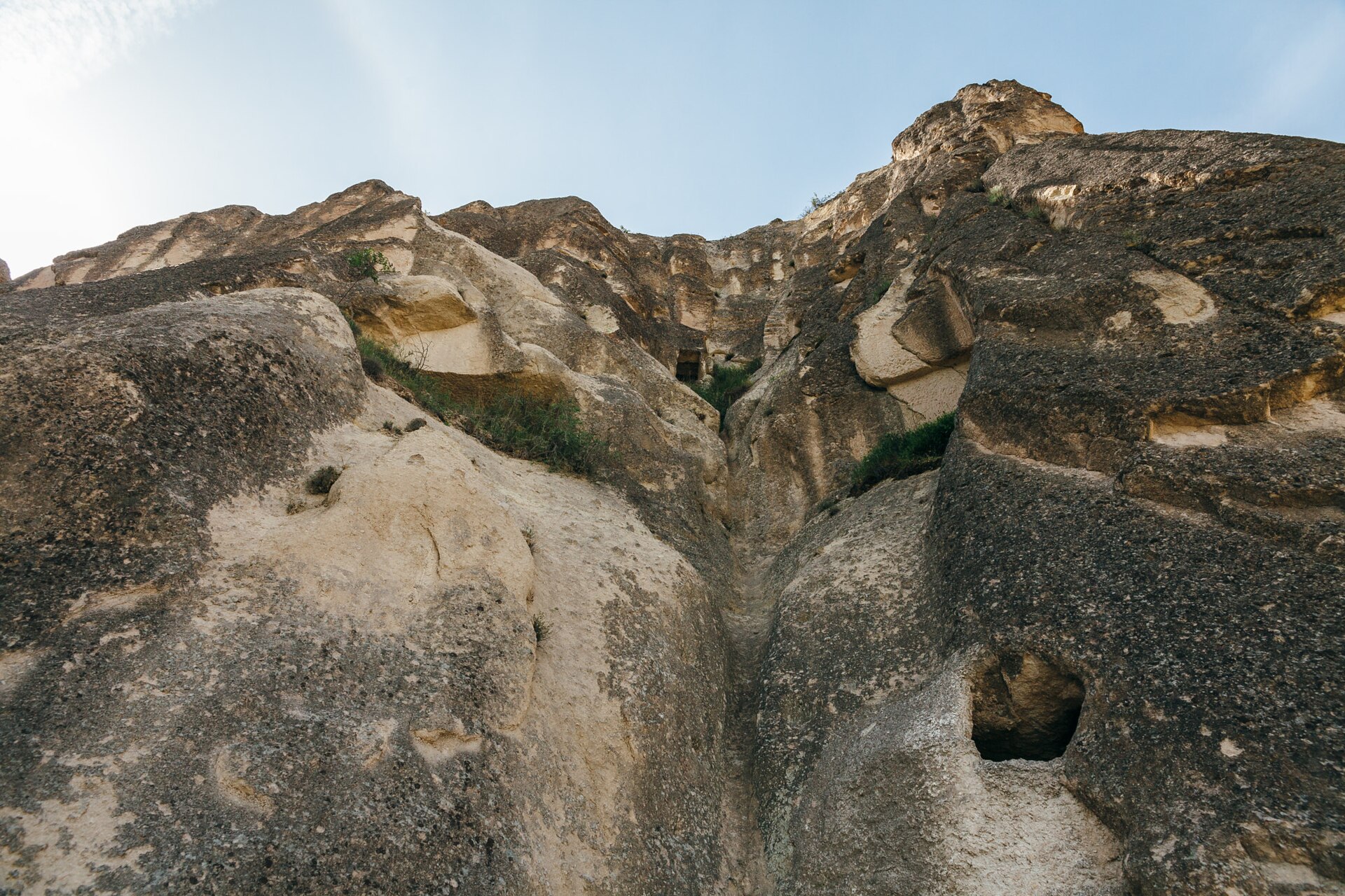 Rock cut chapels and monastic cells carved into pale volcanic cones at the Goreme Open Air Museum in Cappadocia.