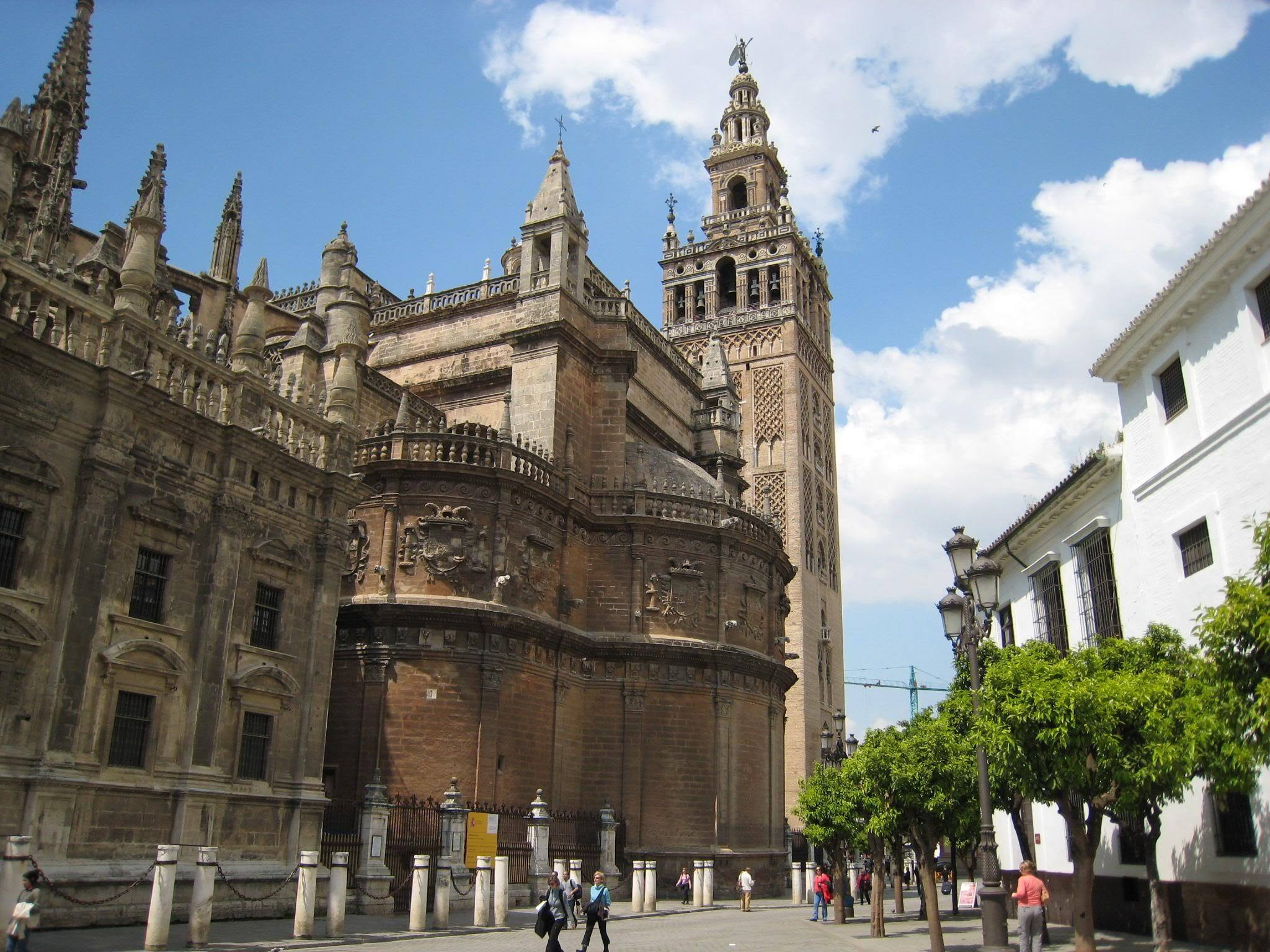Seville Cathedral and its Giralda bell tower rising above the surrounding rooftops in the historic centre of Seville.