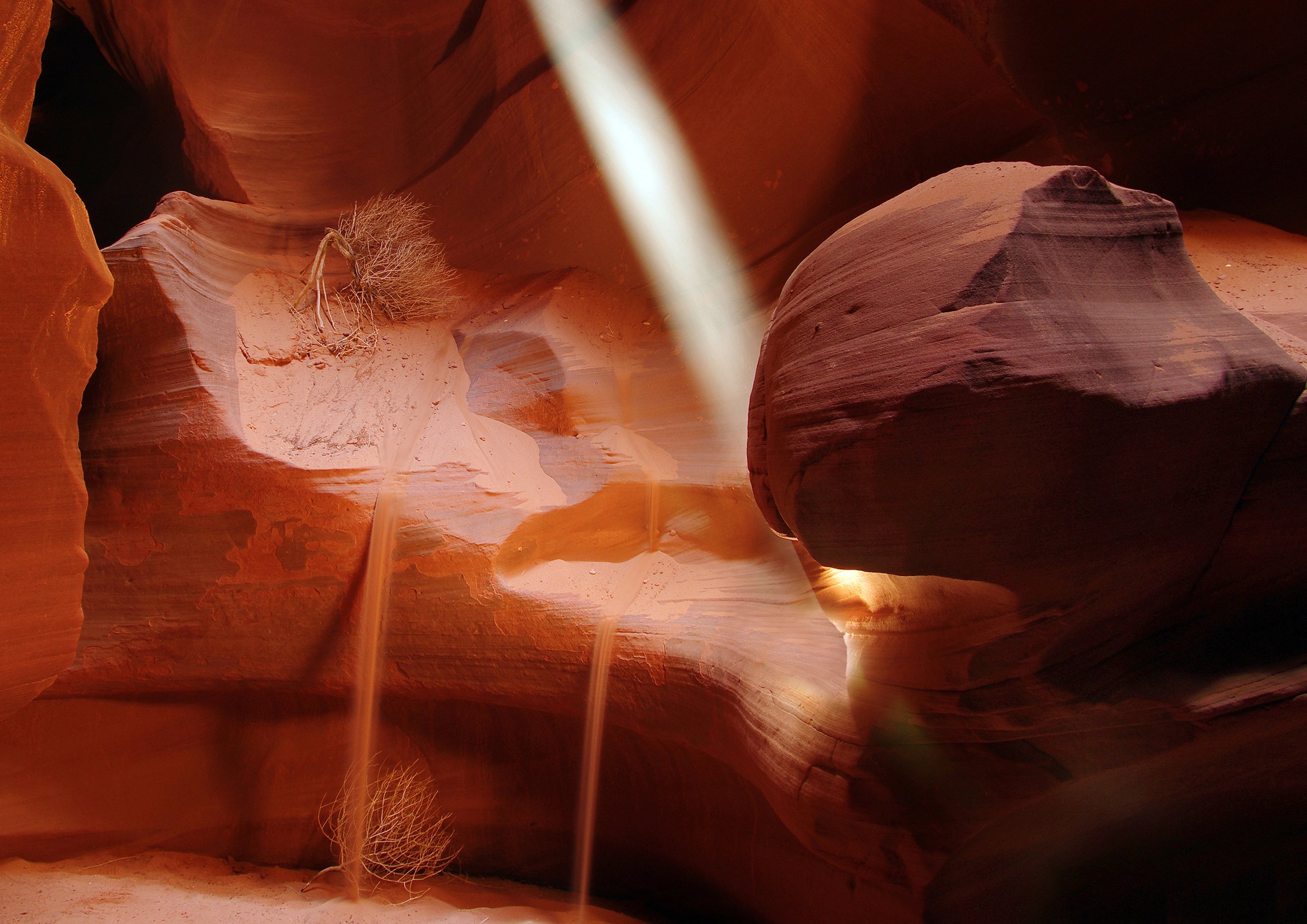 Light beams cutting through the sandstone walls of Upper Antelope Canyon near Page, Arizona.