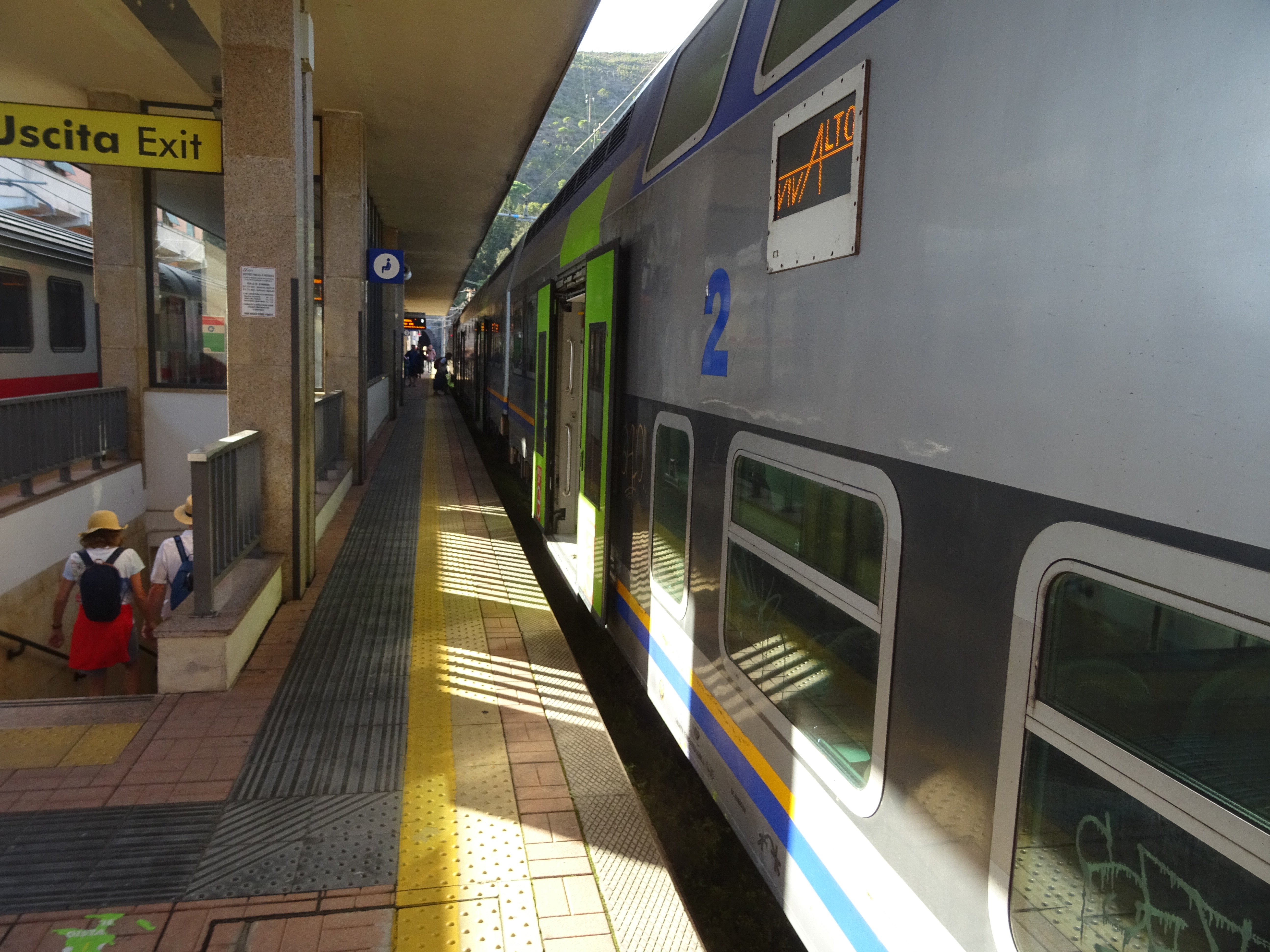 A regional Cinque Terre Express train at the platform in Levanto station, ready to depart.